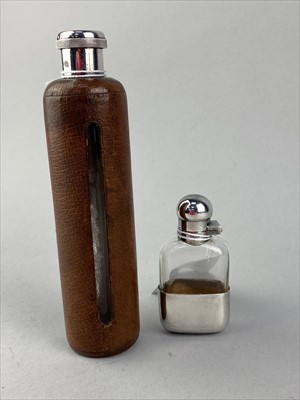Lot 194 - A VICTORIAN GLASS AND SILVER MOUNTED HIP FLASK