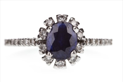 Lot 1311 - A BLUE GEM AND DIAMOND RING