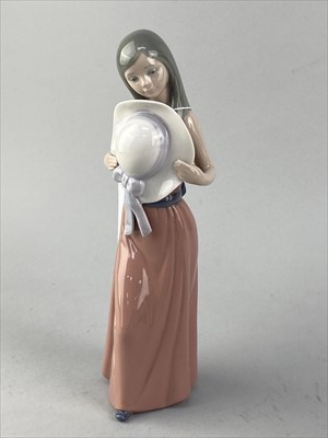 Lot 335 - A LLADRO FIGURE OF A GIRL HOLDING A HAT, THREE OTHER LLADRO FIGURES AND THREE NAO FIGURES