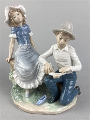 Lot 309 - A LLADRO GROUP OF CHILDREN ON A SEESAW, ANOTHER LLADRO FIGURE AND A NAO GROUP