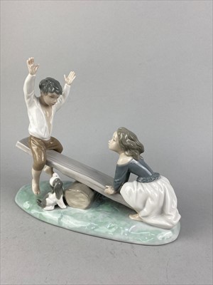 Lot 309 - A LLADRO GROUP OF CHILDREN ON A SEESAW, ANOTHER LLADRO FIGURE AND A NAO GROUP