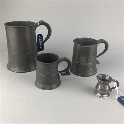 Lot 344 - THREE GRADUATED PEWTER MUGS AND A MEASURE