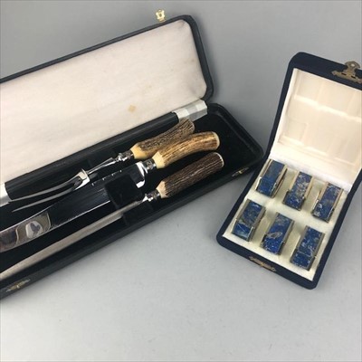 Lot 350 - A THREE PIECE CARVING SET AND A CASED SET OF NAPKIN RINGS