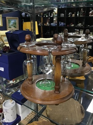 Lot 370 - A STAINED WOOD CIRCULAR GLASSES RACK