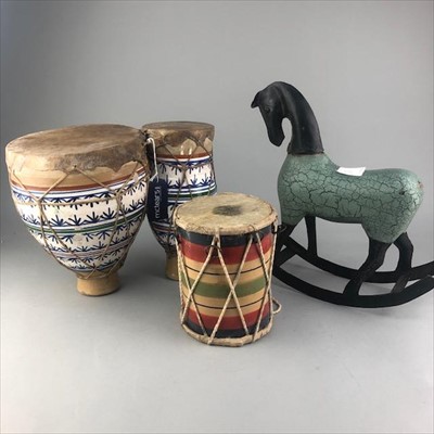Lot 232 - A PAIR OF CERAMIC BONGOS ALONG WITH A DRUM AND A ROCKING HORSE