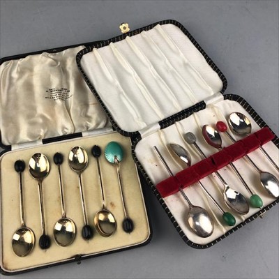 Lot 415 - A CASED SET OF ENAMEL AND GILDED COFFEE BEAN SPOONS AND ANOTHER SET