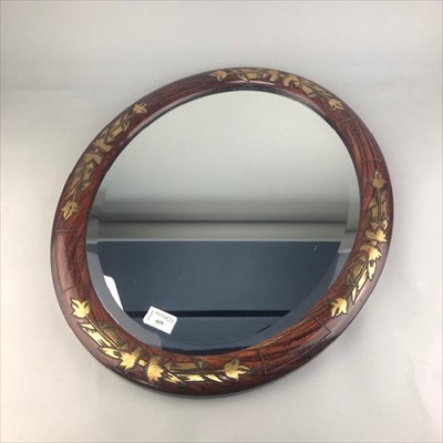 Lot 419 - A DECORATIVE OVAL WALL MIRROR