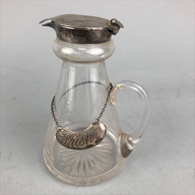 Lot 428 - A SILVER MOUNTED GLASS WHISKY TOT AND A SILVER LABEL