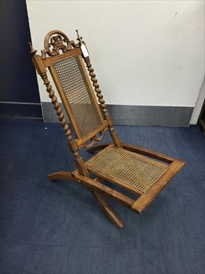 Lot 444 - A 19TH CENTURY WALNUT CANE PANELLED FOLDING CHAIR