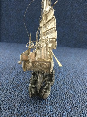 Lot 723 - A CHINESE WHITE METAL MODEL OF A JUNK