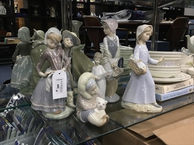 Lot 480 - A LLADRO FIGURE OF A BOY AND GIRL ALONG WITH THREE OTHER FIGURES