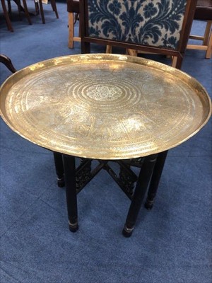 Lot 149 - AN EASTERN BRASS TOPPED OCCASIONAL TABLE