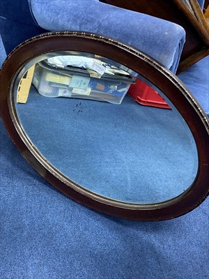 Lot 208 - A MODERN WALL CLOCK AND AN OVAL WALL MIRROR