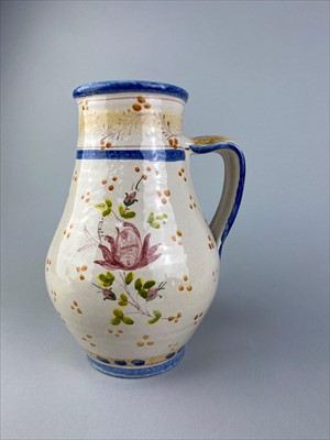 Lot 218 - A FLORAL HANDPAINTED CERAMIC EWER, TWO TEA POTS AND A CANDLESTICK