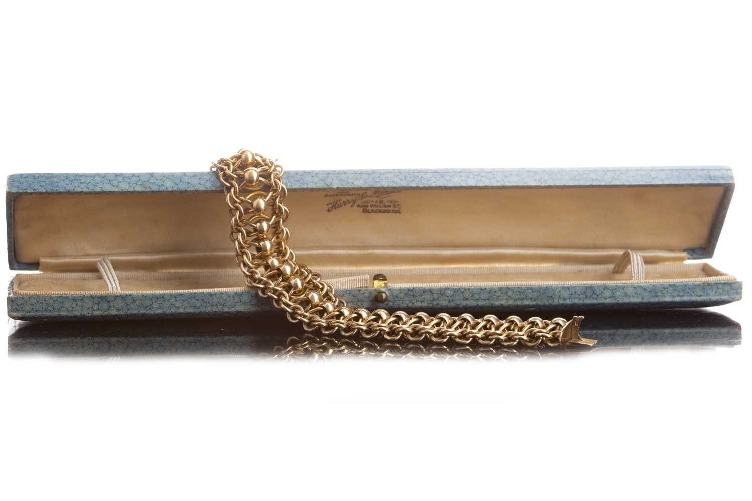 Lot 824 - A GOLD BRACELET WITH SPHERES