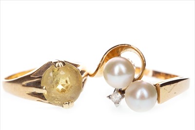 Lot 832 - A YELLOW GEM SET RING AND A PEARL RING