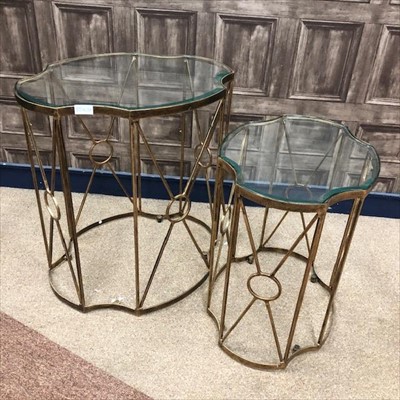 Lot 233 - A NEST OF TWO GLASS TOPPED TABLES