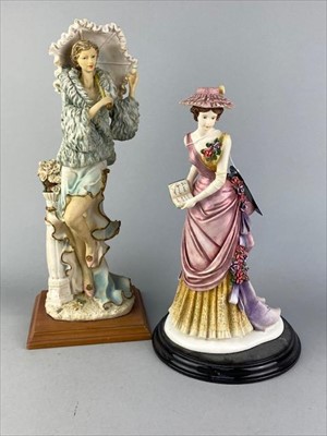 Lot 72 - A RESIN FIGURE OF A FEMALE AND FOUR OTHER FIGURES