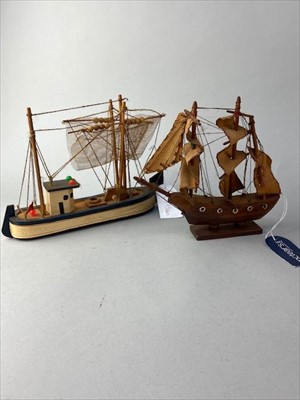 Lot 173 - A MODEL OF A BATTLESHIP, FOUR OTHER MODELS AND A SPITFIRE PAPERWEIGHT