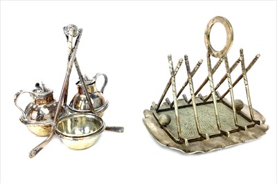 Lot 1766 - A SILVER PLATED TOASTRACK AND A CRUET SET