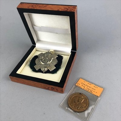 Lot 282 - A HIGHLAND LIGHT INFANTRY CAP BADGE ALONG WITH A CORONATION MEDAL