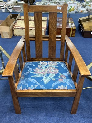 Lot 329 - A STAINED WOOD RECLINING ELBOW CHAIR