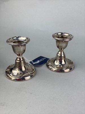 Lot 427 - A PAIR OF EARLY 20TH CENTURY SILVER CANDLESTICKS
