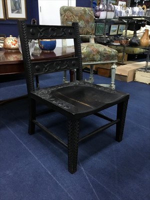 Lot 451 - A CARVED OAK NURSING CHAIR