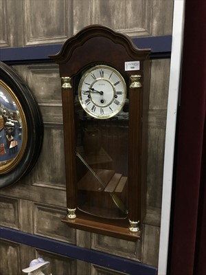 Lot 508 - A REPRODUCTION STAINED WOOD WALL CLOCK