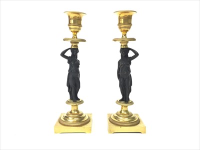 Lot 1419 - A PAIR OF 19TH CENTURY CAST METAL AND BRASS FIGURAL CANDLESTICKS