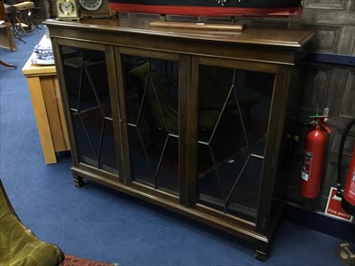 Lot 554 - A MAHOGANY THREE DOOR GLAZED BOOKCASE