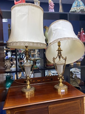 Lot 559 - A PAIR OF EARLY 20TH CENTURY BRASS AND CUT GLASS TABLE LAMPS