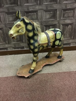 Lot 1457 - AN EARLY 20TH CENTURY PAINTED PAPIER MACHE NURSERY HORSE