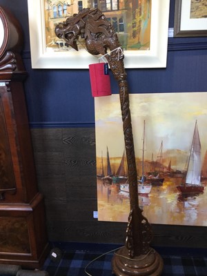 Lot 765 - A CHINESE CARVED WOOD STANDARD LAMP