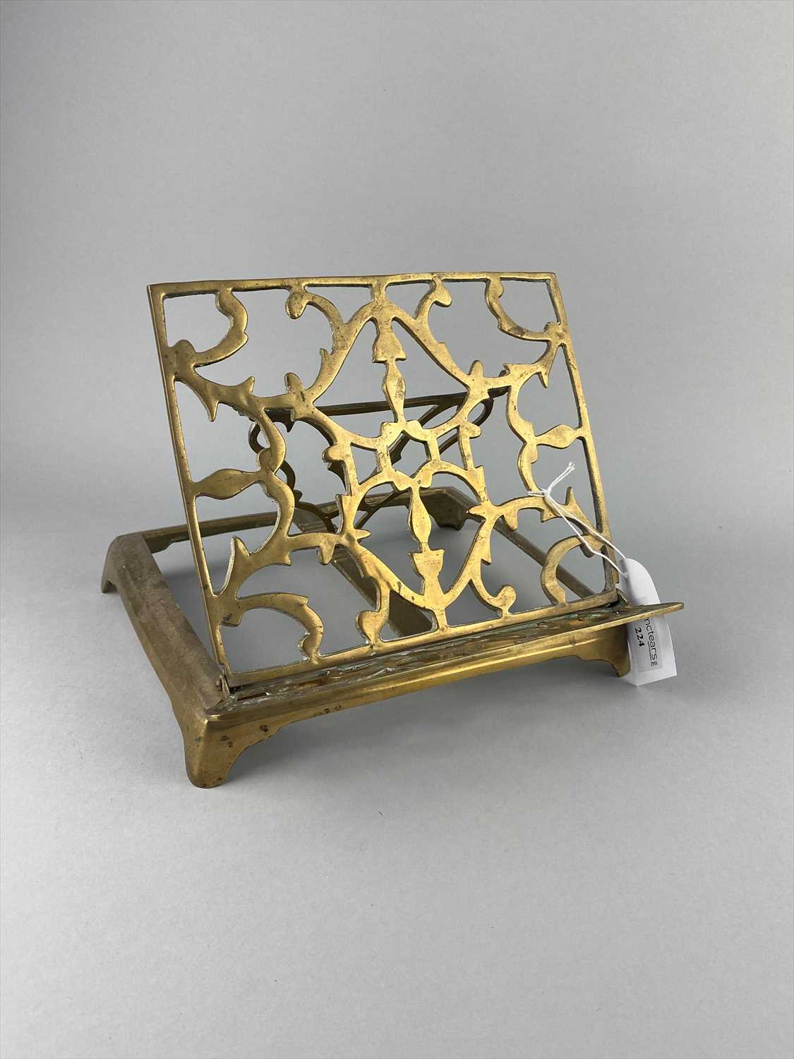Lot 224 - A BRASS FOLDING MUSIC STAND OF EASTERN DESIGN