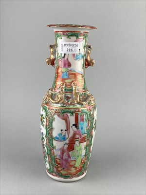 Lot 223 - A CANTONESE VASE AND A STONEWARE FIGURE OF A HORSE