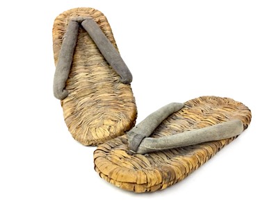 Lot 768 - A PAIR OF CANE SLIPPERS AND A NUT PRESS