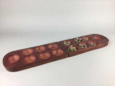 Lot 3 - A BOXED MANCALA GAME ALONG WITH AN AFRICAN EWER AND WALL MASK