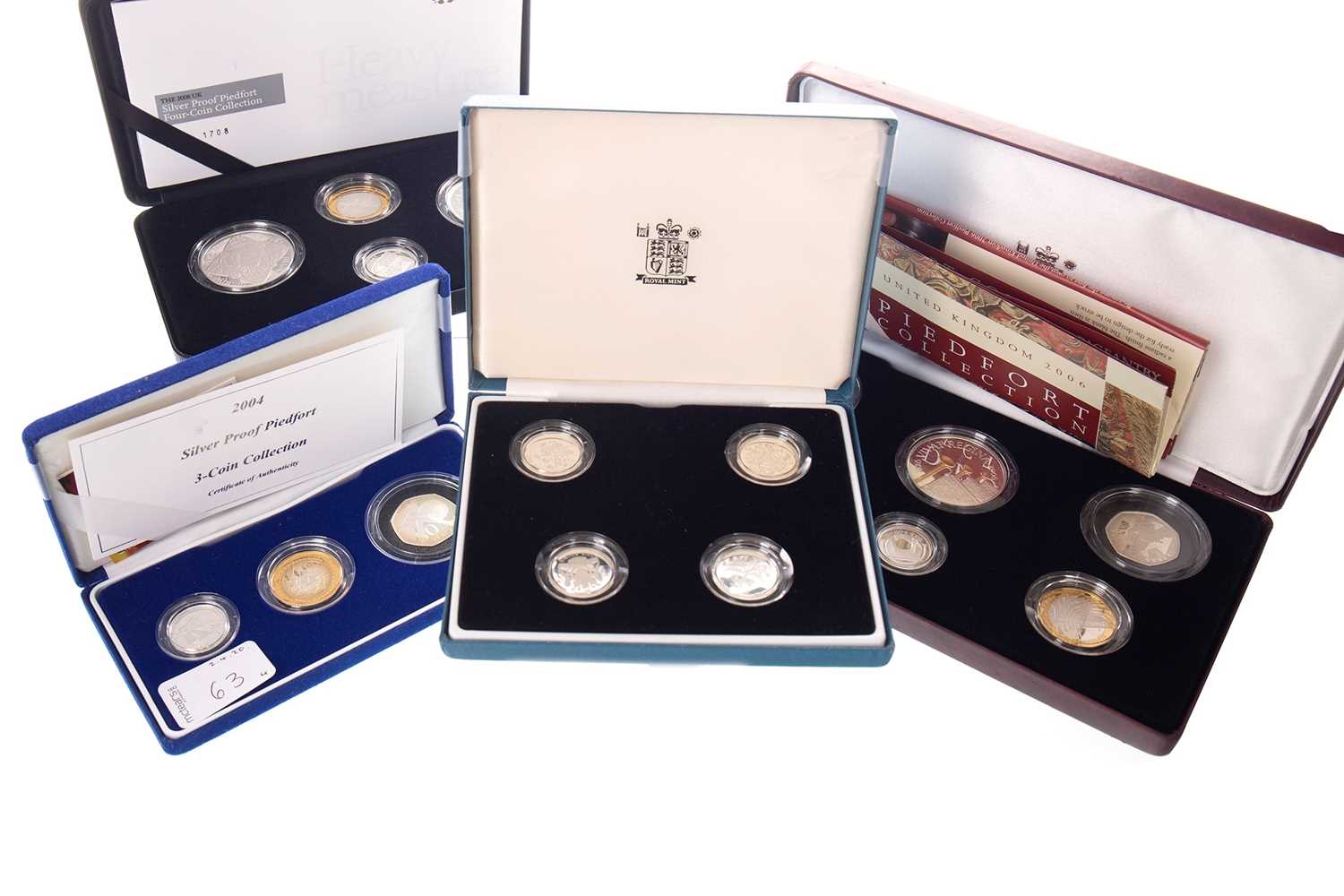 Lot 63 - FOUR SILVER COIN SETS