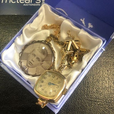 Lot 331 - A NINE CARAT GOLD CASED WRIST WATCH AND TWO CHAINS, ONE WITH PENDANT