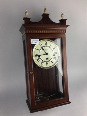Lot 335 - A REPRODUCTION WALL CLOCK BY COMITTI OF LONDON