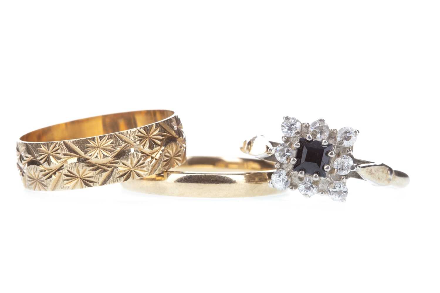 Lot 386 - TWO WEDDING BANDS AND A GEM SET CLUSTER RING