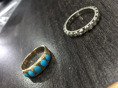 Lot 388 - A TURQUOISE FIVE STONE RING AND A GEM SET ETERNITY RING
