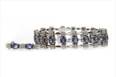 Lot 403 - AN IMPRESSIVE BLUE GEM AND DIAMOND BRACELET AND EARRINGS