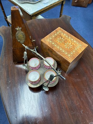 Lot 482 - A FRENCH METRONOME, BRASS INLAID CASKET AND AN EGG EPERGNE