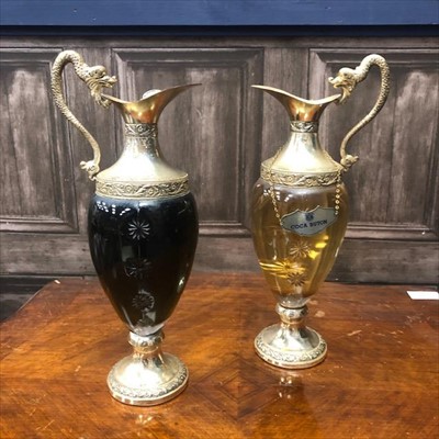 Lot 439 - A PAIR OF GLASS AND SILVER PLATED CLARET JUGS