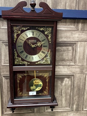 Lot 497 - A REPRODUCTION WALL CLOCK