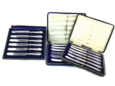 Lot 448 - A LOT OF THREE SETS OF SILVER MOUNTED TEA KNIVES