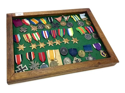 Lot 1620 - A FRAMED GROUP OF BRITISH AND GERMAN WWI AND WWII MEDALS