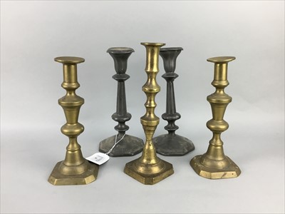 Lot 306 - A PAIR OF PEWTER CANDLESTICKS ALONG WITH THREE BRASS CANDLESTICKS